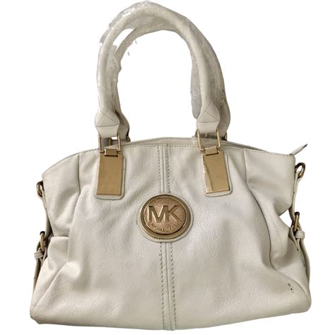 white michael kors bag with gold mk medallion|Michael Kors optic white handbags.